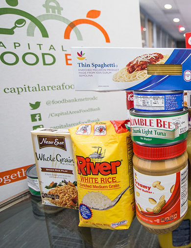 photo of nonperishable food items in front of a donation box