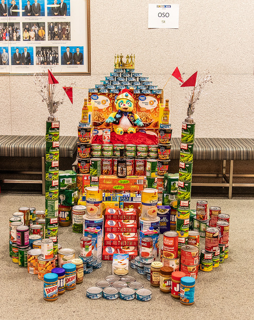 photo of cans stacked as a giant throne